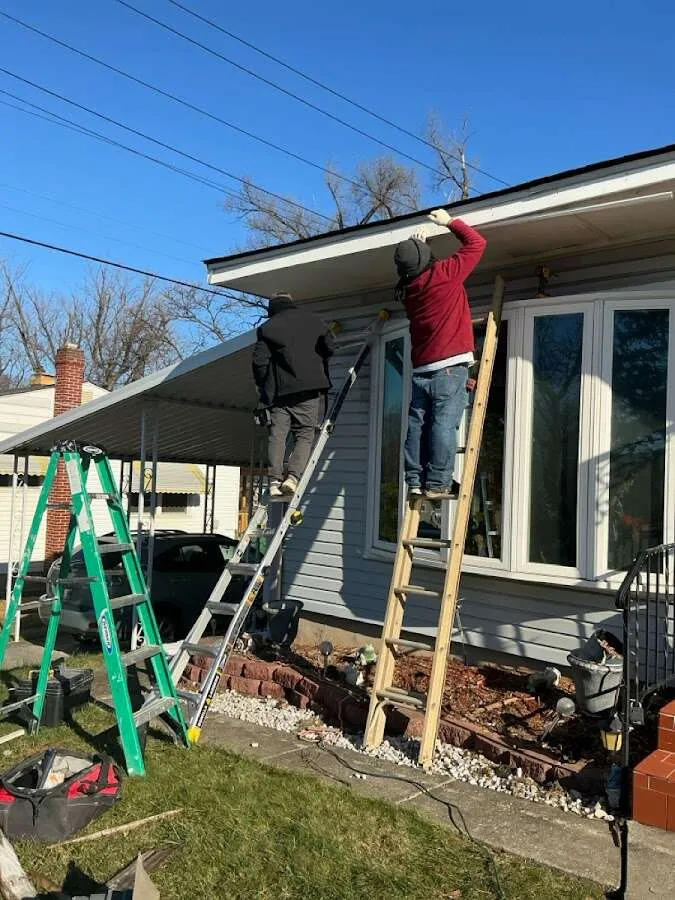 Restoration crew performing exterior repair in Monroe